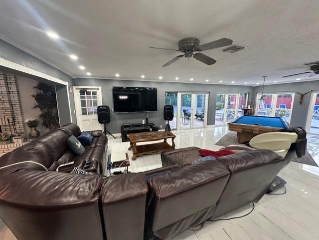 5800 Pine Tree Road Parkland, FL 33067 - Photo 14 of 35 a living room with furniture and a flat screen tv