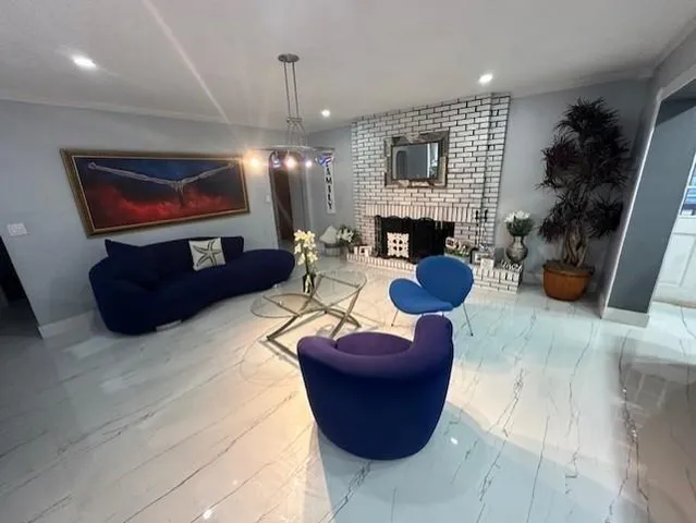 a living room with furniture rug and window