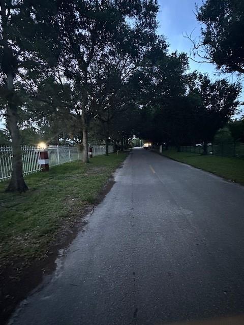 5800 Pine Tree Road Parkland, FL 33067 - Photo 33 of 35 a view of a street with a house in the background