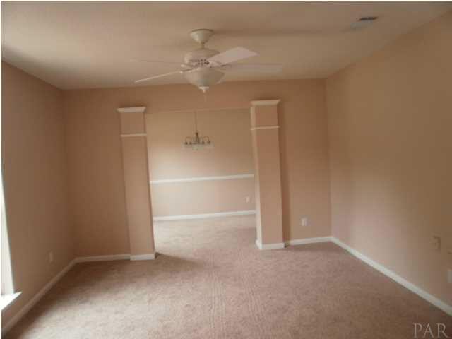 5185 Flax Road Pensacola, FL 32504 - Photo 4 of 25 Formal Living and Dining Room are divided by columns, and have an extra touch with the crown molding.