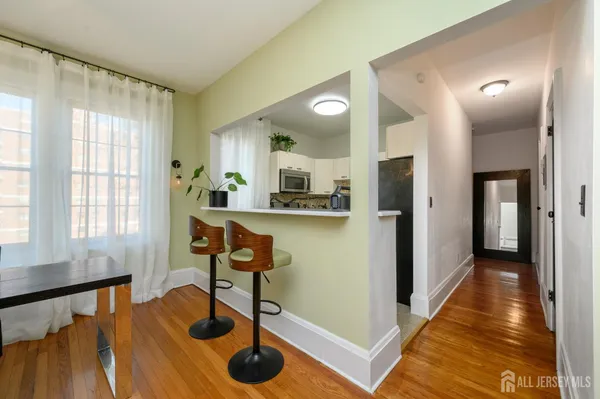 a view of a livingroom with workspace and a couch