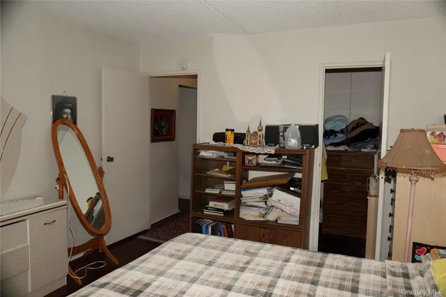a bedroom with a bed and a desk