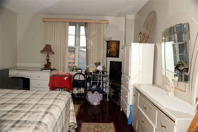 a bed room with a bed furniture and a window