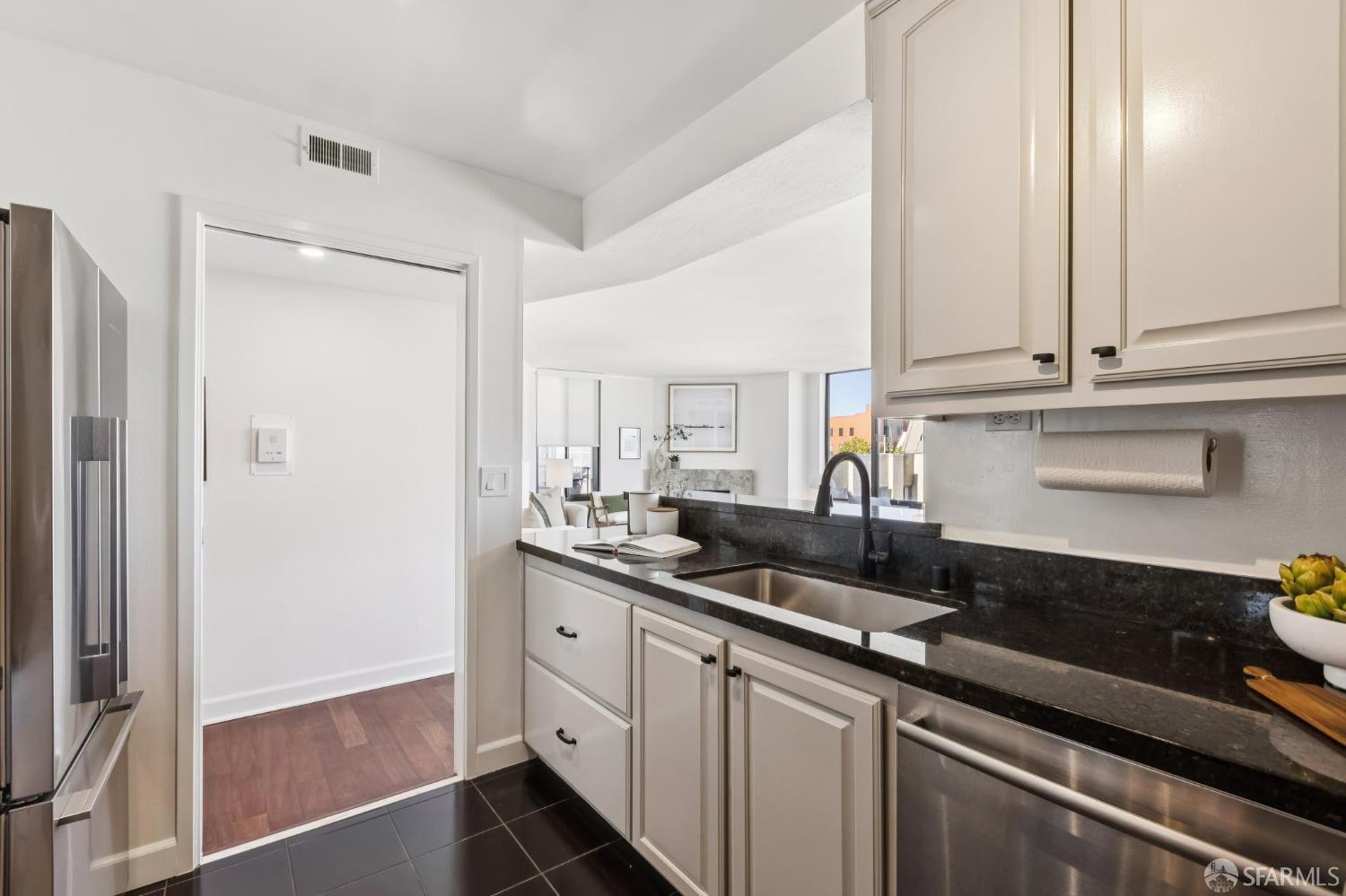 150 Lombard Street, Unit 807 San Francisco, CA 94111 - Photo 30 of 68 a kitchen with stainless steel appliances granite countertop a sink stove and cabinets