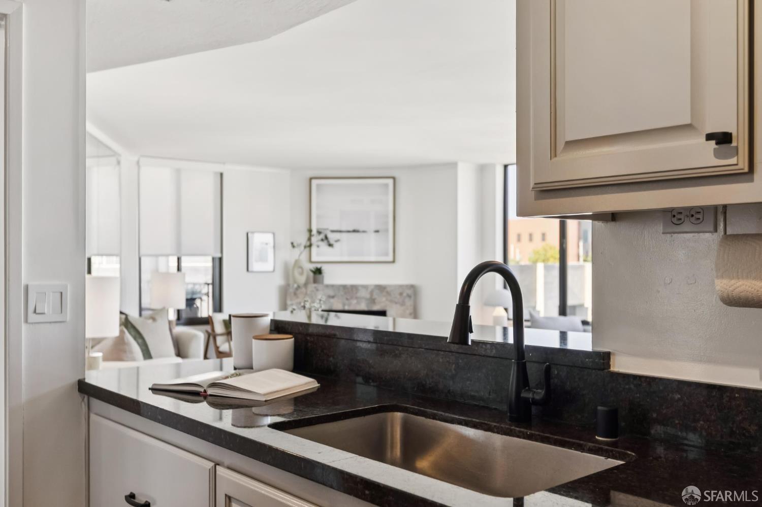 150 Lombard Street, Unit 807 San Francisco, CA 94111 - Photo 31 of 68 a kitchen with a sink and cabinets