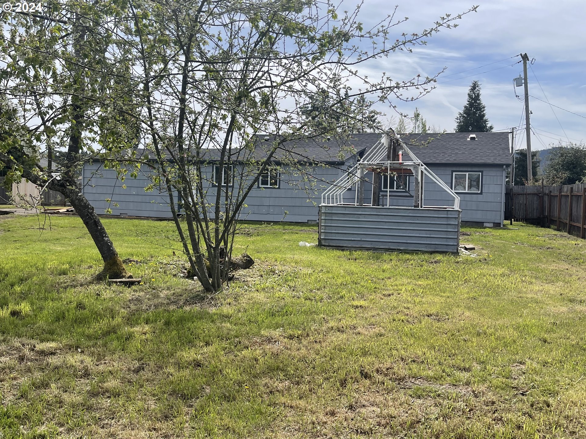 4530 Aster Street Springfield, OR 97478 - Photo 3 of 10 a front view of a house with a yard