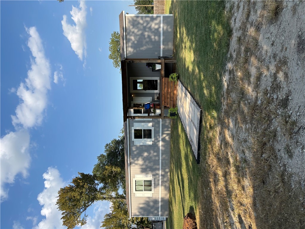 101 Edwards Street Franklin, TX 77856 - Photo 13 of 15 a swimming pool view with a big yard and large trees
