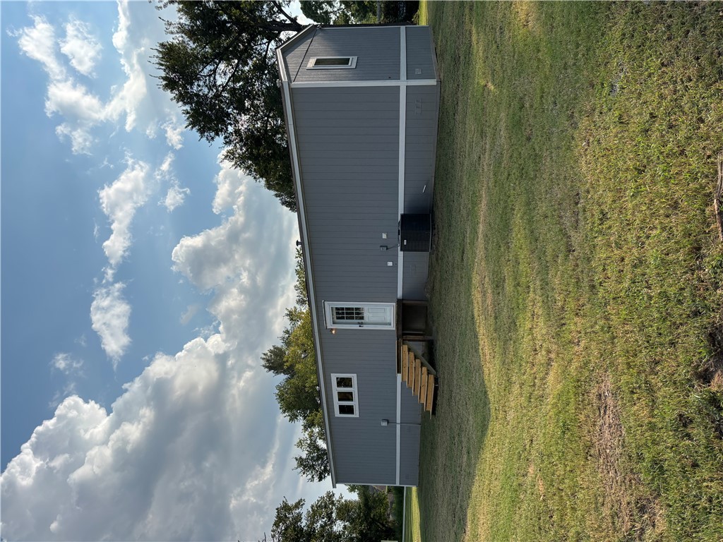 101 Edwards Street Franklin, TX 77856 - Photo 4 of 15 a view of a backyard