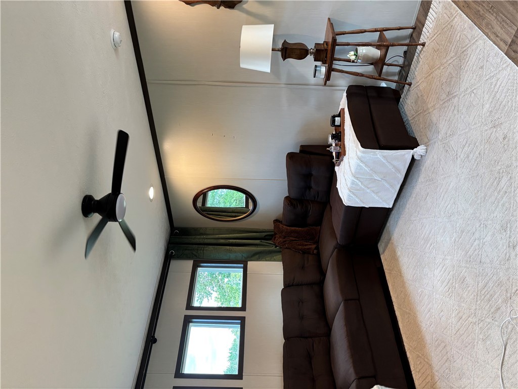 101 Edwards Street Franklin, TX 77856 - Photo 8 of 15 a living room with furniture and a wall painting