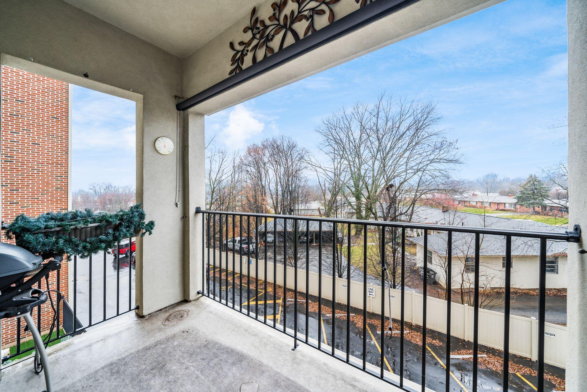 3175 Tremont Road, Unit 311 Columbus, OH 43221 - Photo 18 of 26 West facing balcony with gorgeous sunset views and gas grill hook-up.