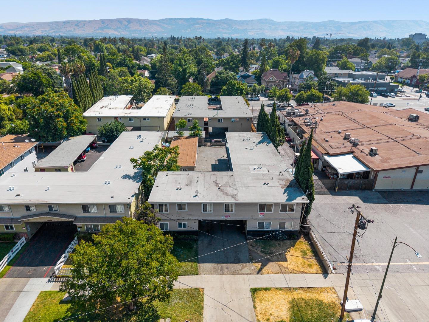 an aerial view of a houses with a swimming pool