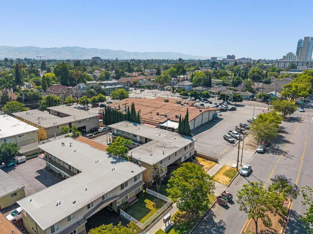 an aerial view of a houses with a swimming pool