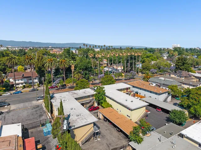 a view of a street with car parked