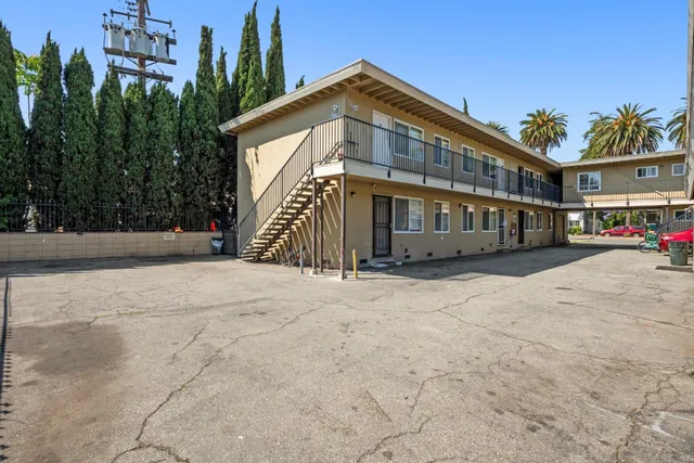 a view of a pathway with a wrought iron stairs