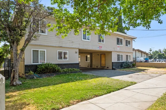 a front view of a house with garden