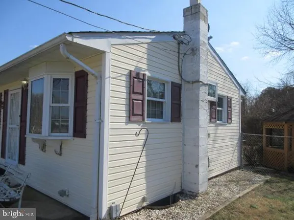 a view of a house with a door and wooden floor