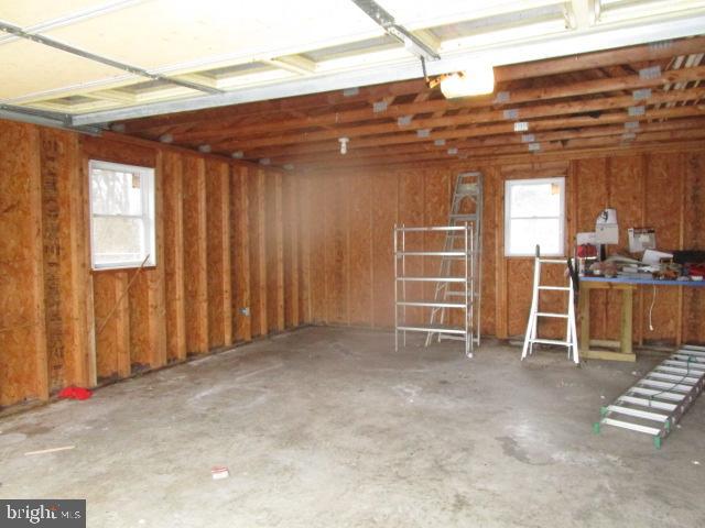 344 Cayots Corner Road Chesapeake City, MD 21915 - Photo 8 of 28 a view of an empty room with wooden walls and stairs