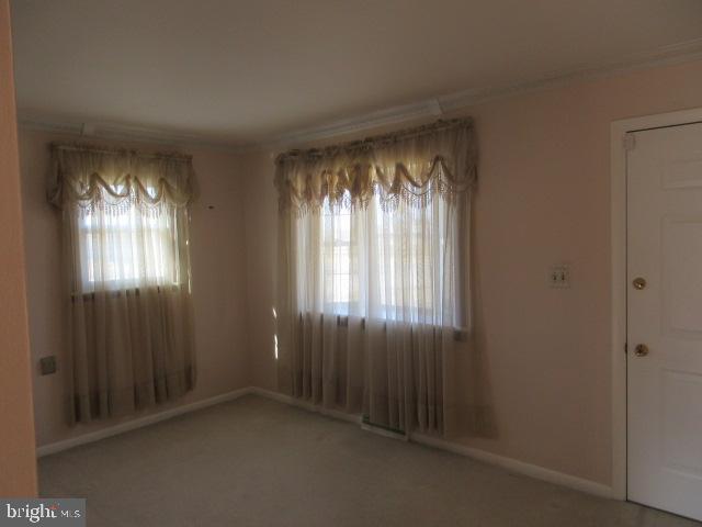 344 Cayots Corner Road Chesapeake City, MD 21915 - Photo 10 of 28 a view of an empty room with windows