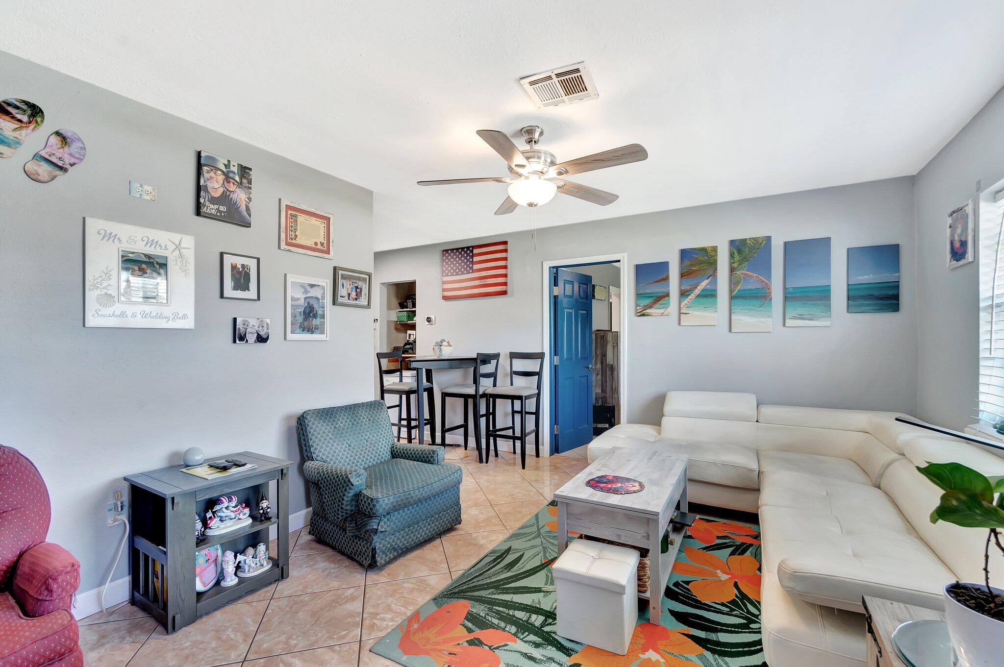 3890 Ocala Road Lake Worth, FL 33462 - Photo 19 of 29 a living room with furniture and wooden floor