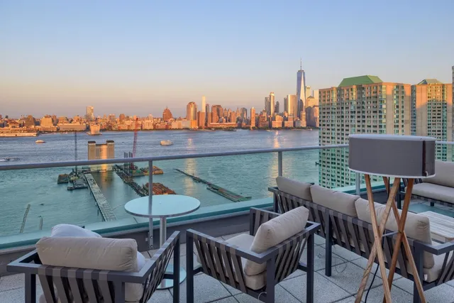 a view of a chairs and table in patio