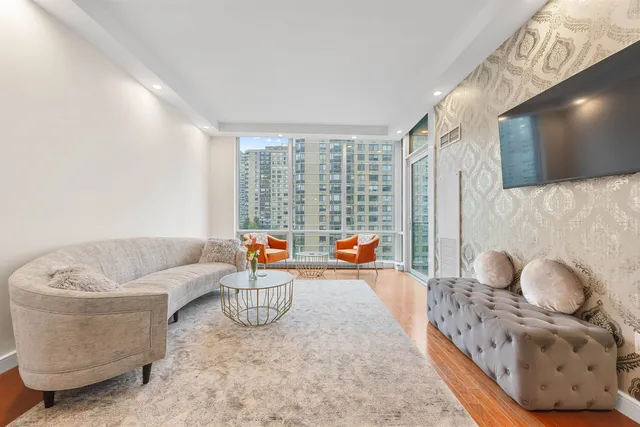a living room with furniture and a flat screen tv