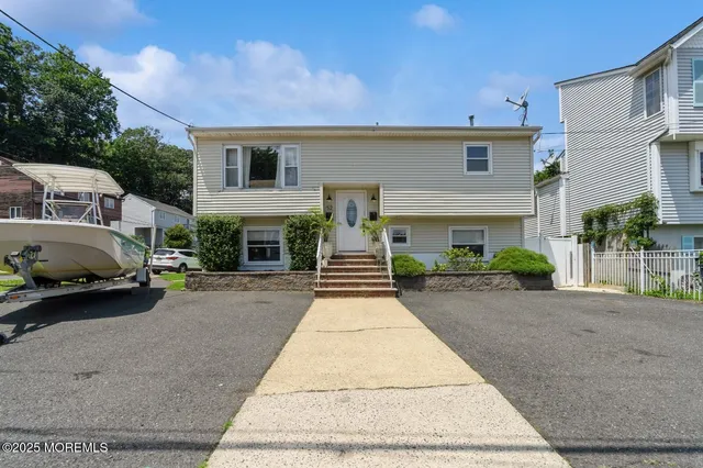 a front view of a house with yard
