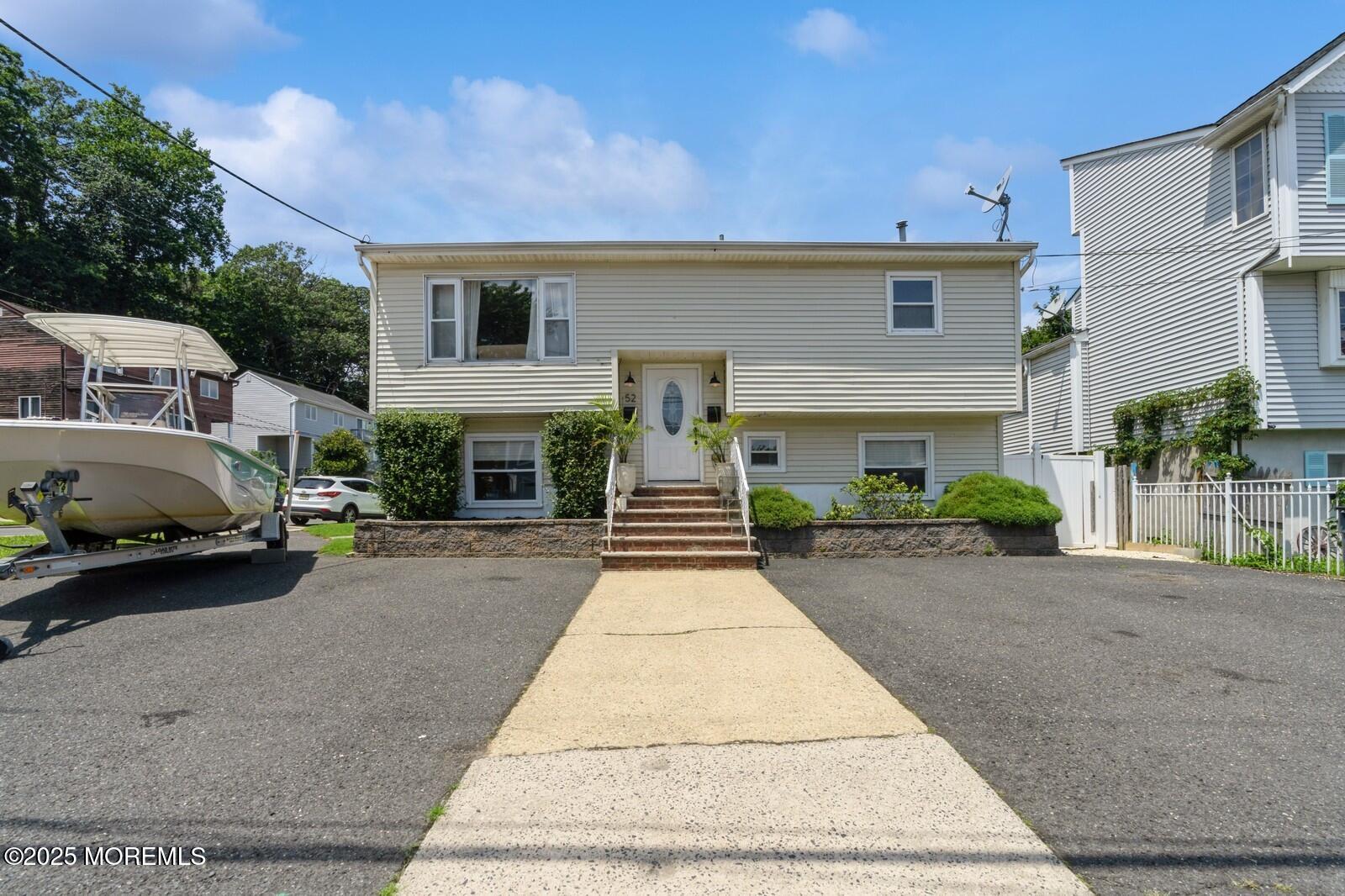 52 Atlantic Street, Unit 2 Highlands, NJ 07732 - Photo 1 of 35 a front view of a house with yard