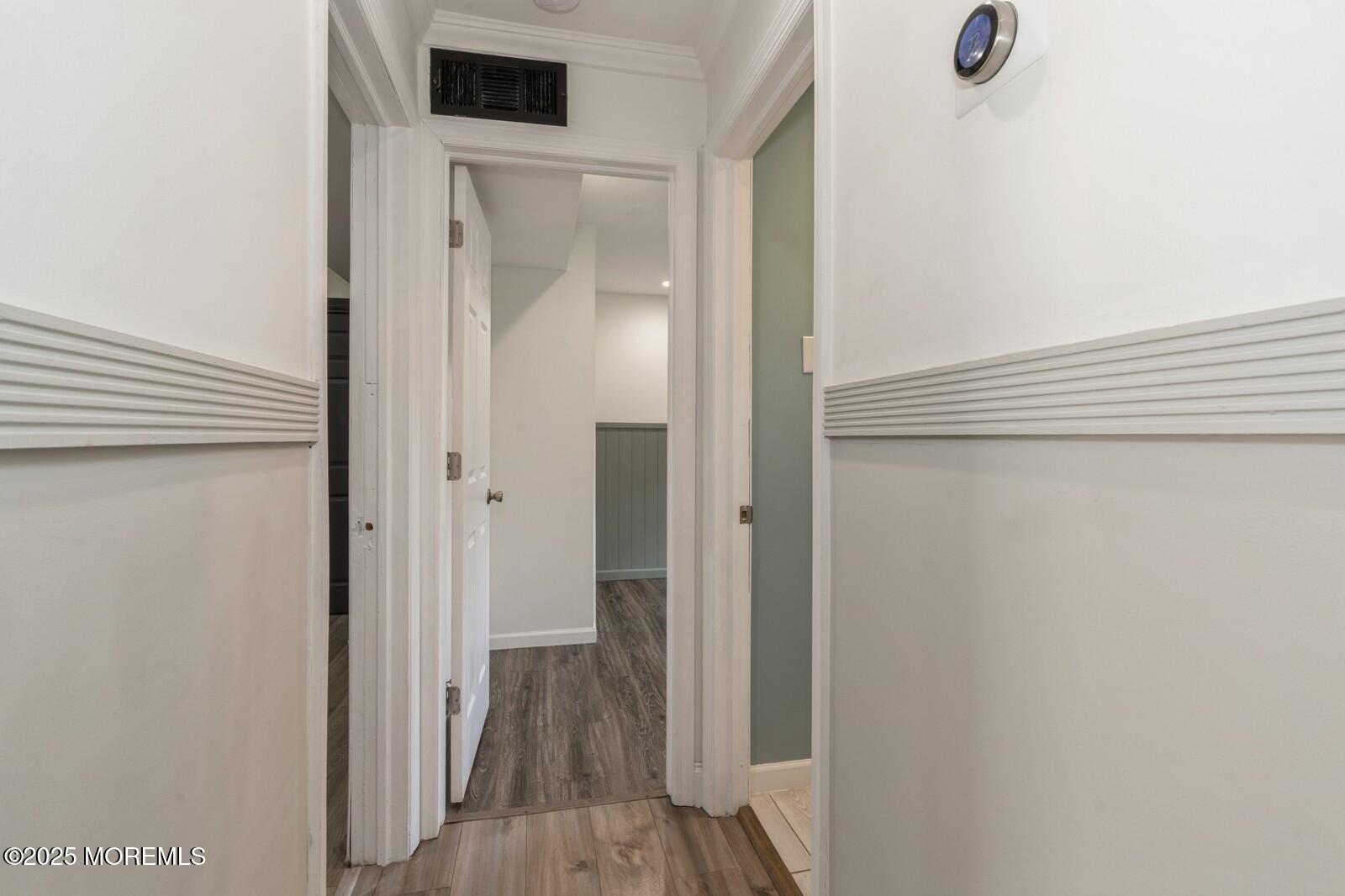 52 Atlantic Street, Unit 2 Highlands, NJ 07732 - Photo 18 of 35 a view of a hallway with wooden floor