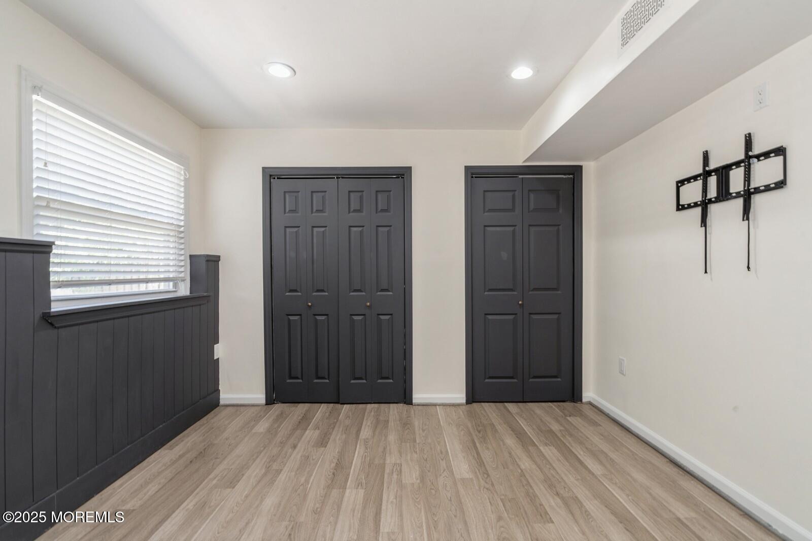 52 Atlantic Street, Unit 2 Highlands, NJ 07732 - Photo 19 of 35 a view of an empty room with closet and a window