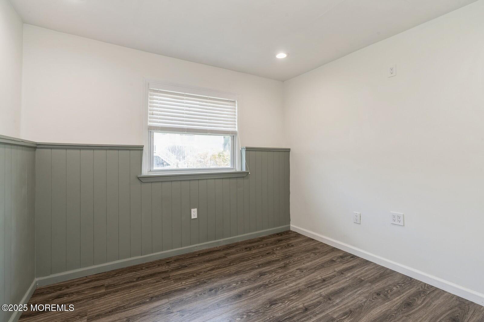 52 Atlantic Street, Unit 2 Highlands, NJ 07732 - Photo 23 of 35 an empty room with wooden floor and windows