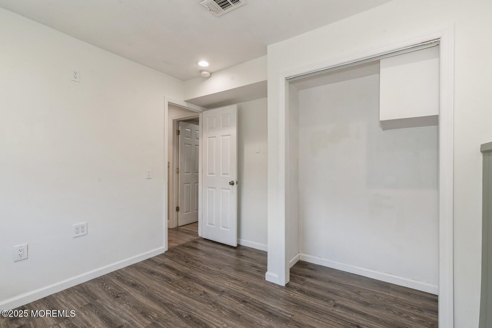 52 Atlantic Street, Unit 2 Highlands, NJ 07732 - Photo 24 of 35 a view of an empty room with wooden floor