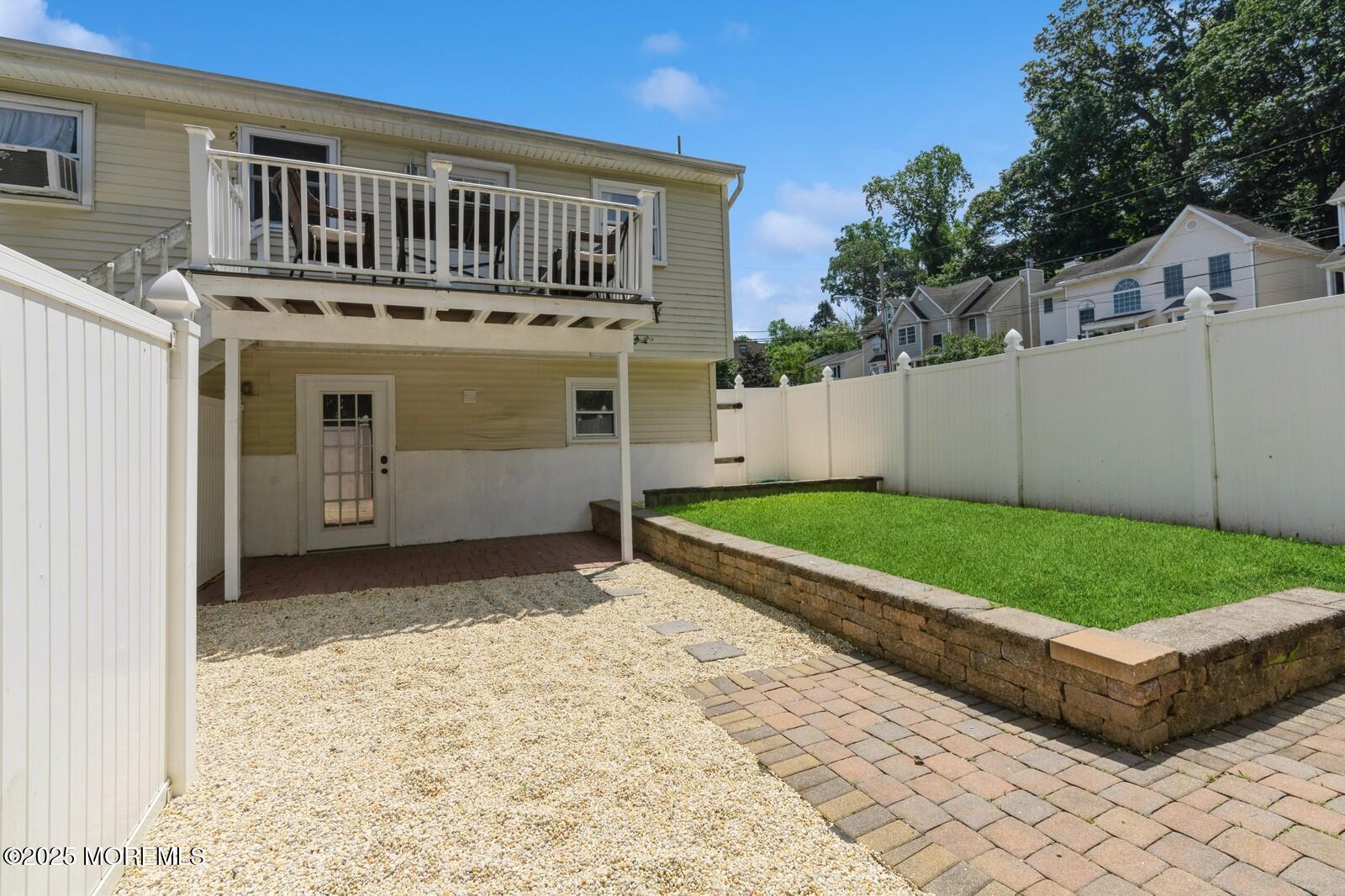52 Atlantic Street, Unit 2 Highlands, NJ 07732 - Photo 27 of 35 a front view of a house with a yard and garage