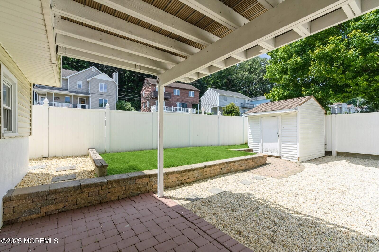 52 Atlantic Street, Unit 2 Highlands, NJ 07732 - Photo 28 of 35 a house with trees in front of it