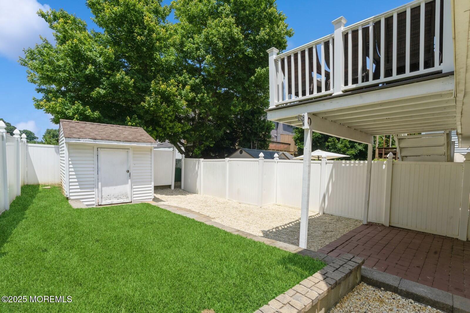 52 Atlantic Street, Unit 2 Highlands, NJ 07732 - Photo 3 of 35 a front view of a house with a yard and fence