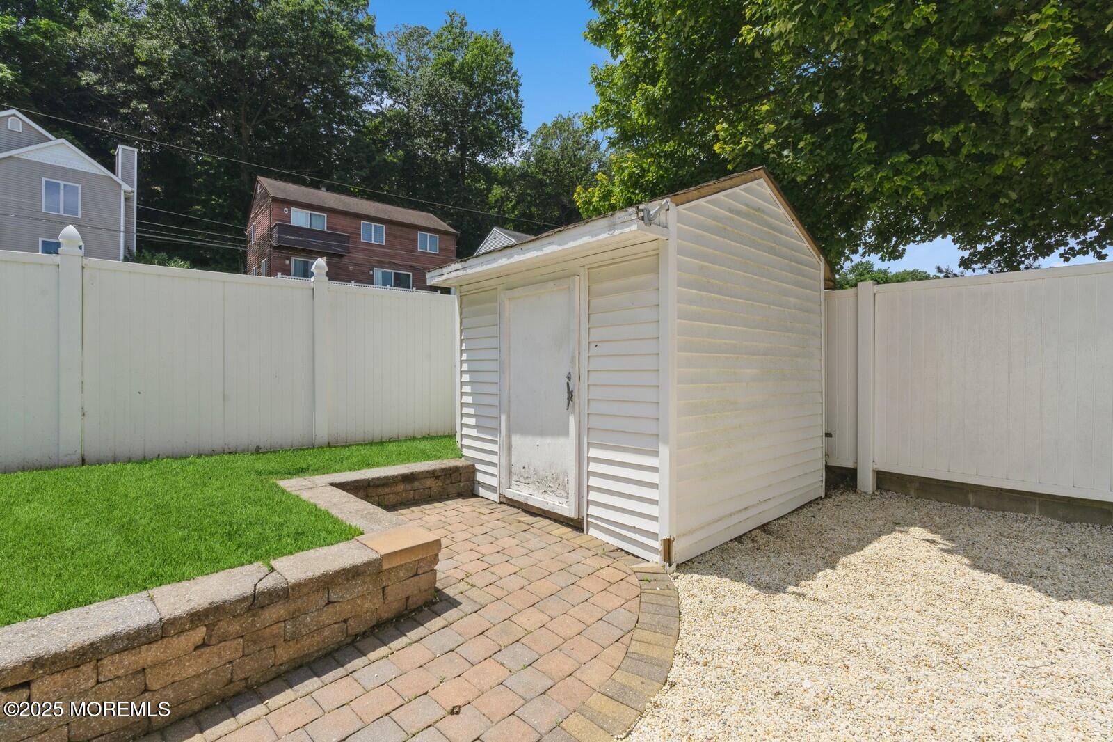 52 Atlantic Street, Unit 2 Highlands, NJ 07732 - Photo 31 of 35 a backyard of a house with lots of green space