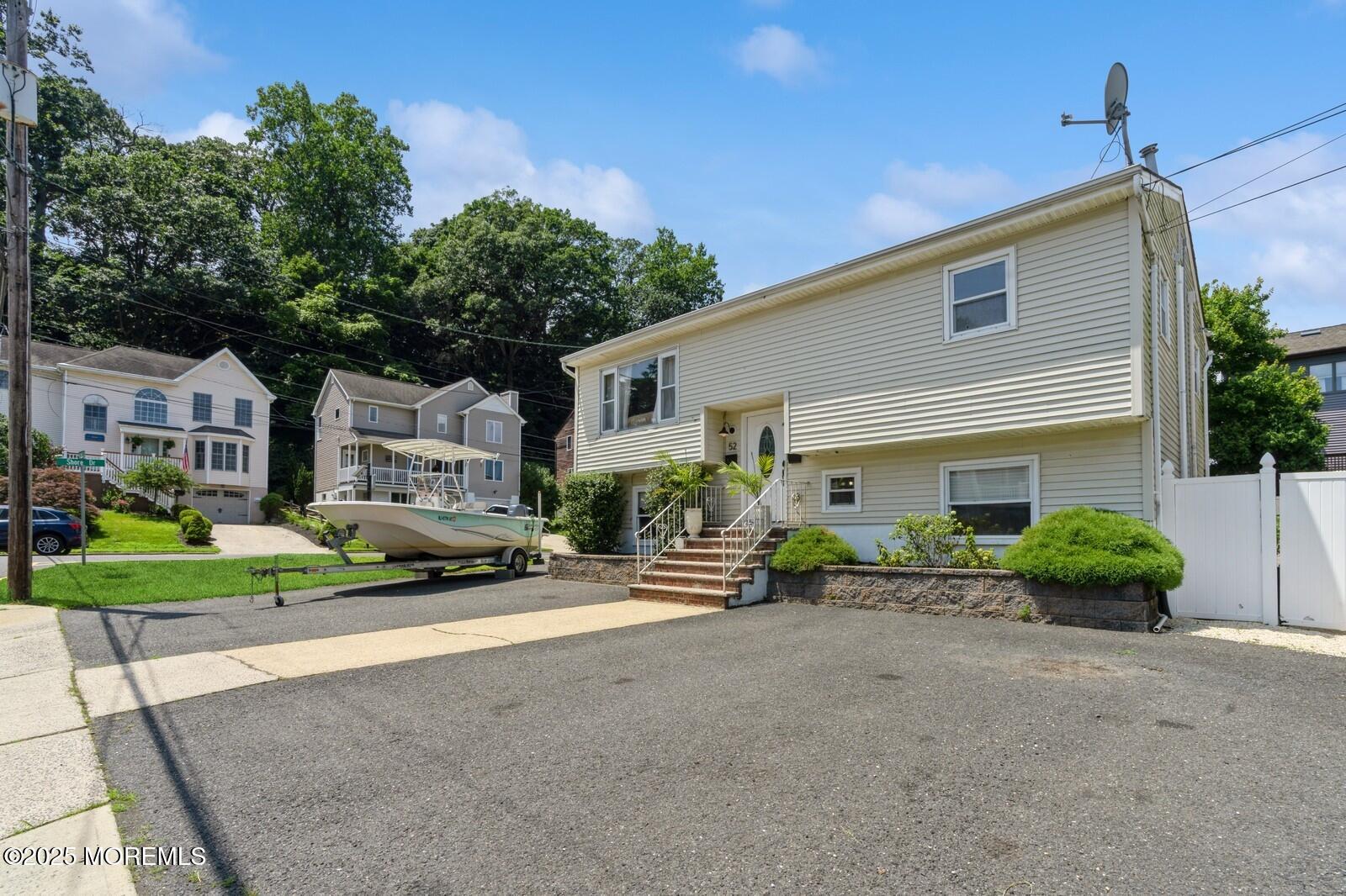 52 Atlantic Street, Unit 2 Highlands, NJ 07732 - Photo 34 of 35 a front view of a house with a yard and garage