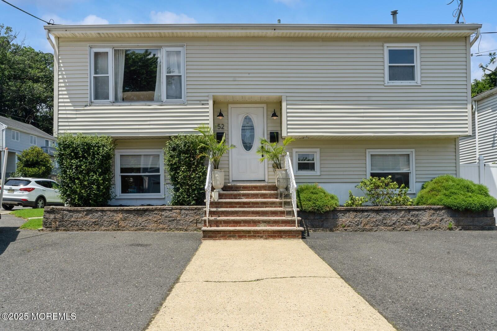 52 Atlantic Street, Unit 2 Highlands, NJ 07732 - Photo 35 of 35 a front view of a house with a garden