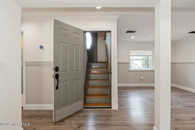 a view of entryway with wooden floor