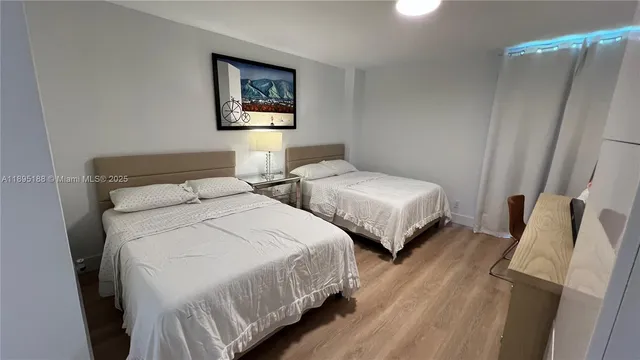 a bathroom with a sink mirror vanity and toilet