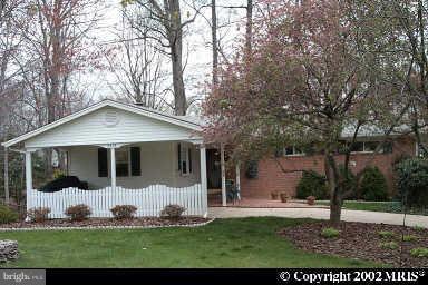 8419 Thames Street Springfield, VA 22151 - Photo 1 of 14 a front view of a house with a yard and garage