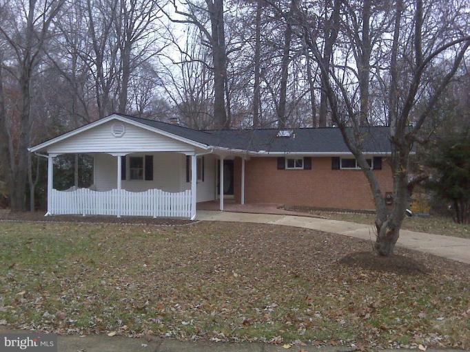 8419 Thames Street Springfield, VA 22151 - Photo 3 of 14 a front view of a house with a yard