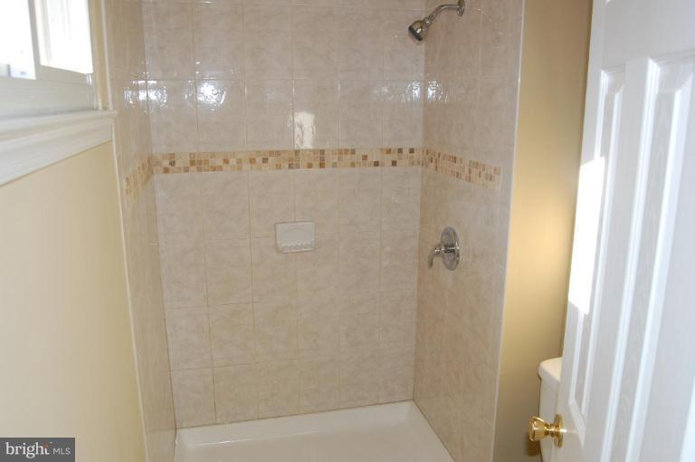 8419 Thames Street Springfield, VA 22151 - Photo 6 of 14 a bathroom with a shower