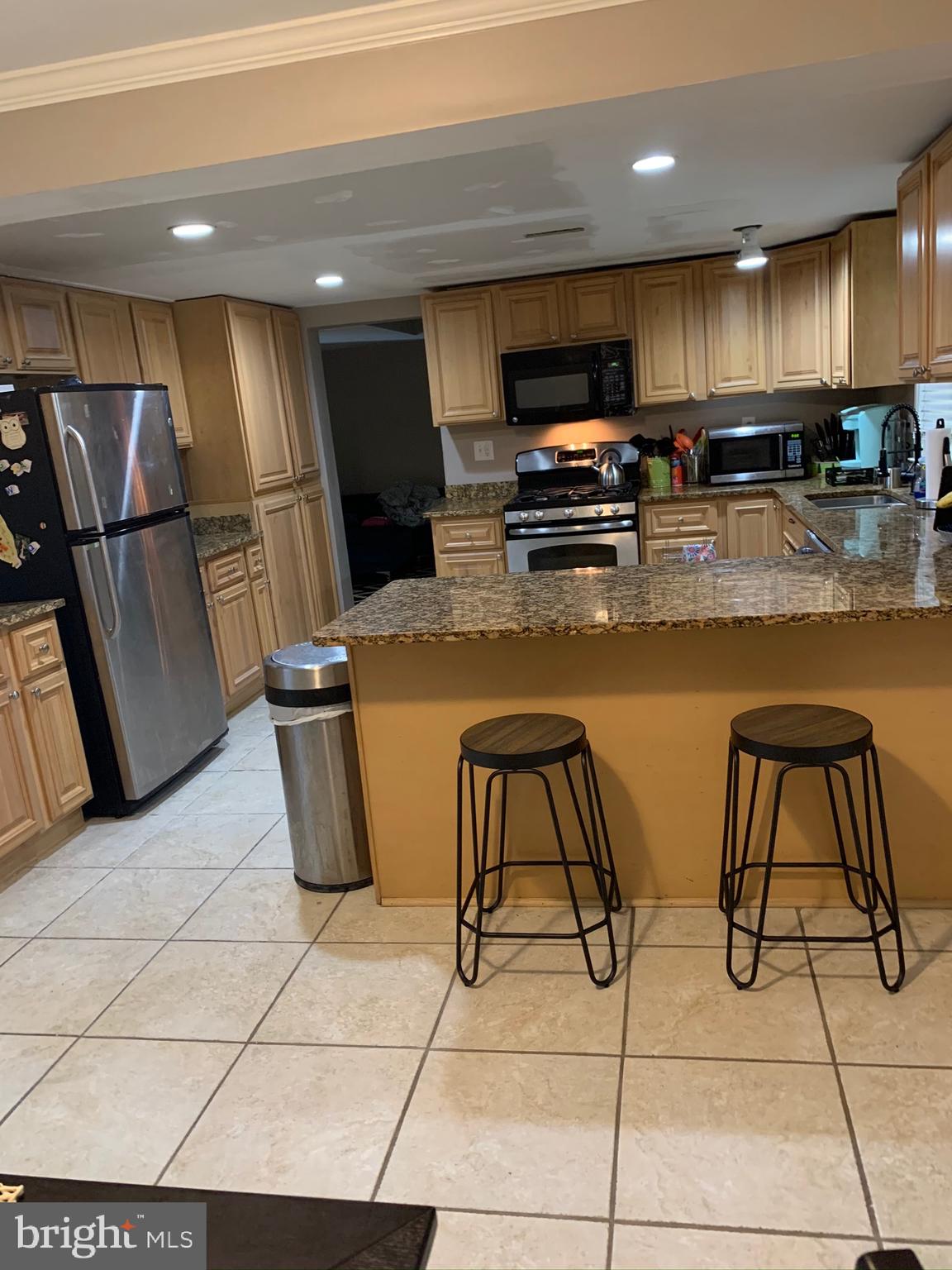 1202 Adams Road Waldorf, MD 20602 - Photo 5 of 12 Kitchen with stainless steel appliances