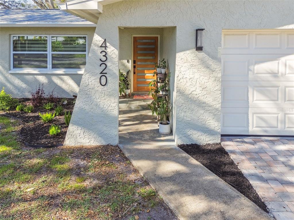 4320 63rd Street North Kenneth City, FL 33709 - Photo 1 of 1 a front view of a house with outdoor space