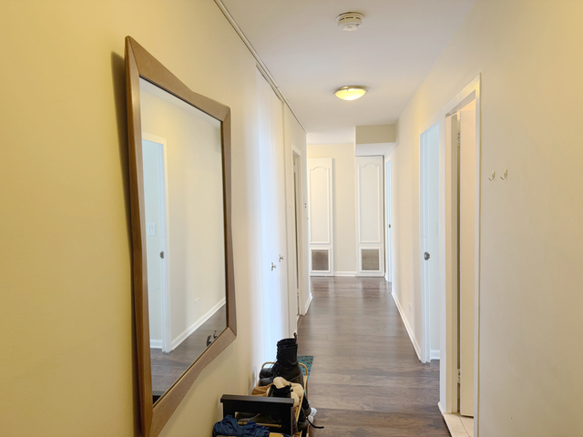 6301 North Sheridan Road, Unit 21E Chicago, IL 60660 - Photo 14 of 29 a view of a hallway with wooden floor