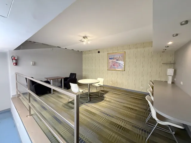 a room with gym equipment and a table