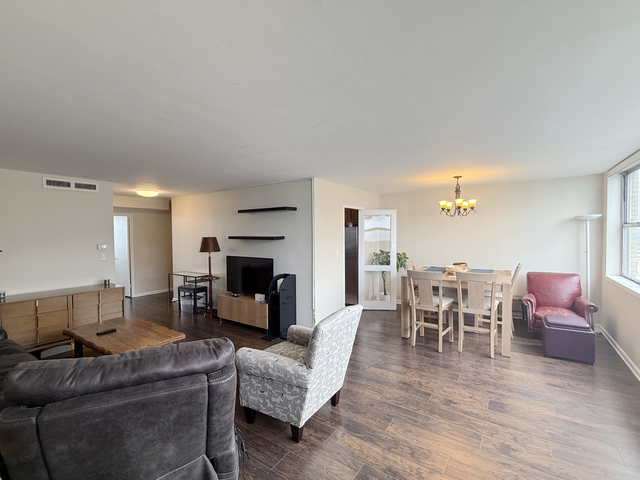 6301 North Sheridan Road, Unit 21E Chicago, IL 60660 - Photo 8 of 29 a living room with furniture and a fireplace