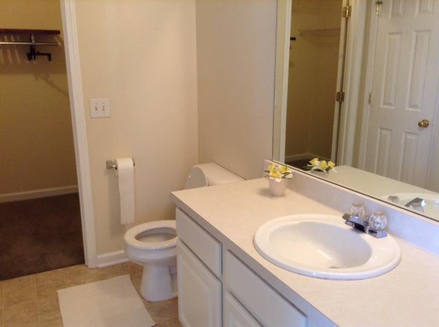 7308 Middlebrook Circle Nashville, TN 37221 - Photo 14 of 20 a bathroom with a sink a toilet and a mirror