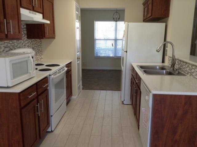 7308 Middlebrook Circle Nashville, TN 37221 - Photo 5 of 20 a kitchen with a stove and a sink