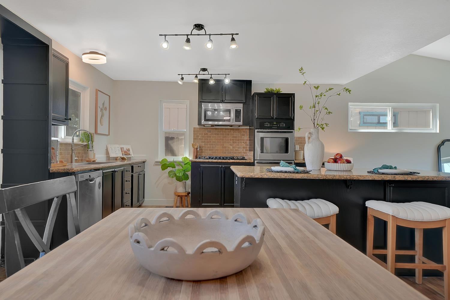 513 Perry Street Jackson, CA 95642 - Photo 11 of 56 a kitchen with a table and chairs in it